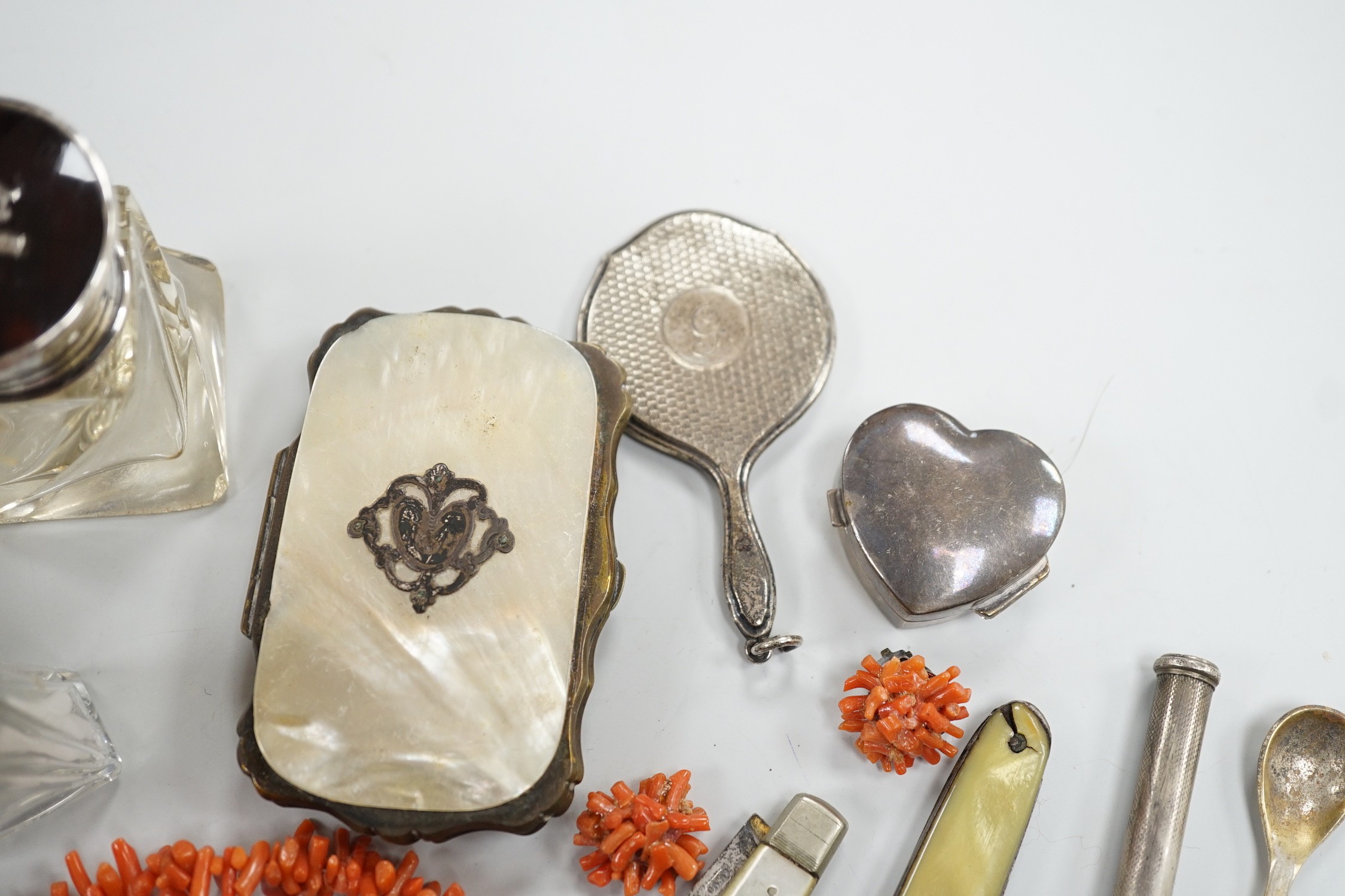 Mixed collectables including silver and tortoiseshell mounted glass toilet jar, miniature hand bag mirror, silver heart pill box, fruit knife, mother of pearl mounted purse, etc.